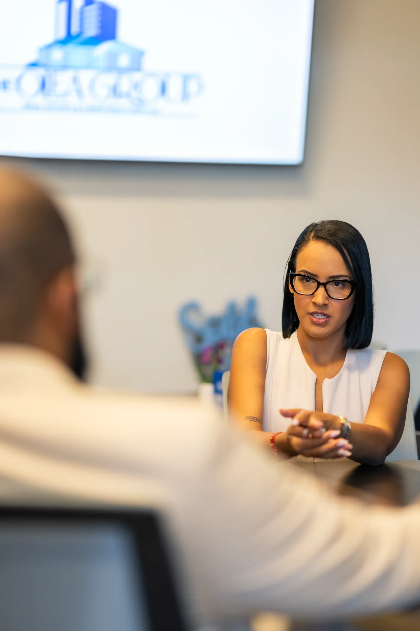 Heidy Olea in a one-on-one conversation at the office
