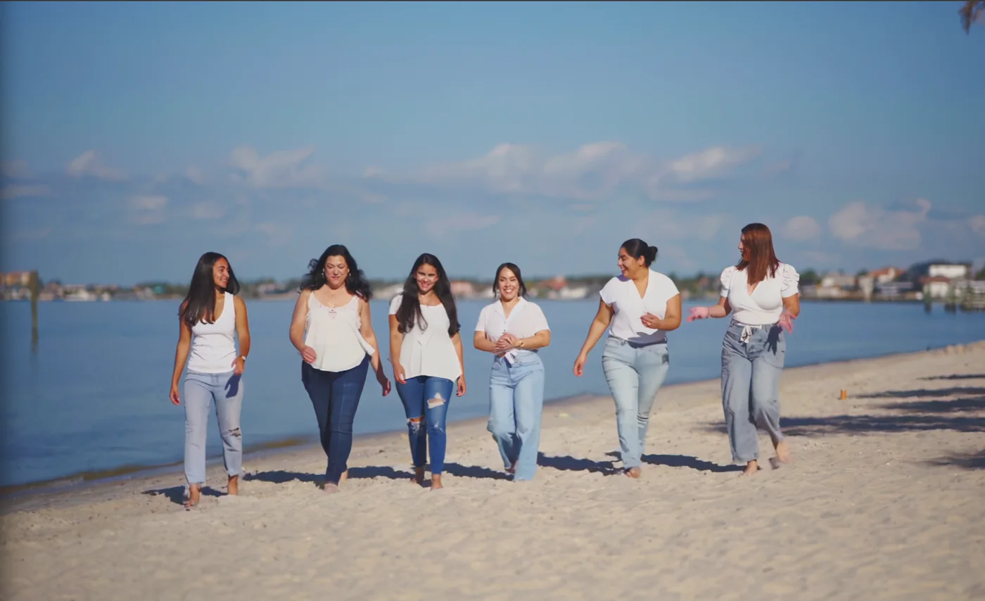 Olea Group team walking together along the waterfront